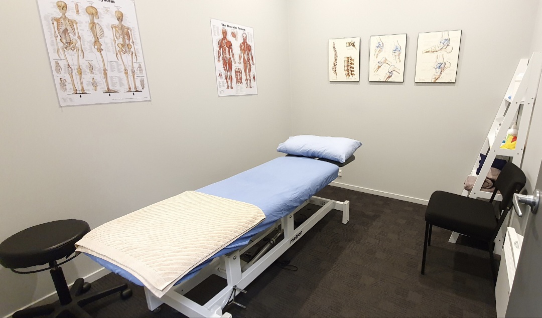 Professional physiotherapy treatment room at PhysioMed Otago clinic in South Dunedin